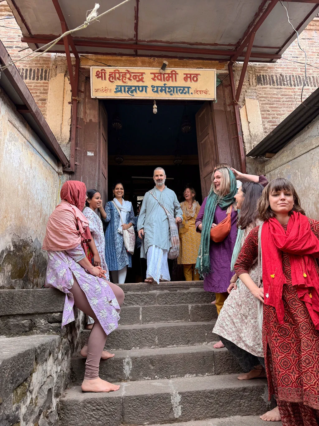 Harshada and a group walking through a doorway
